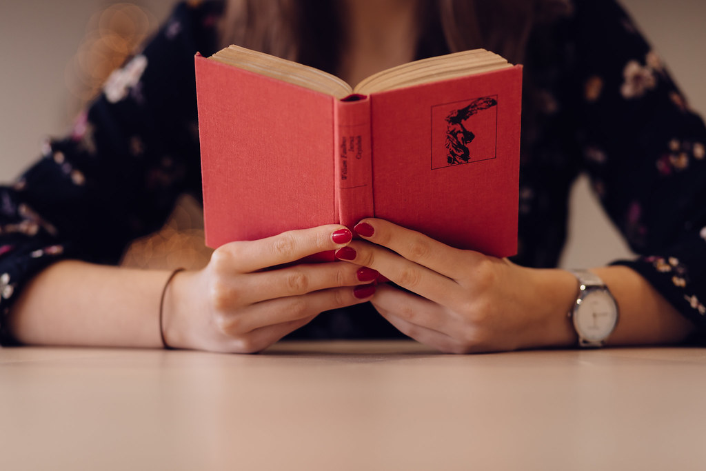 Girl reading a book at school